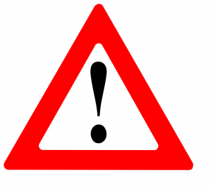 An exclamation point in a red triangle