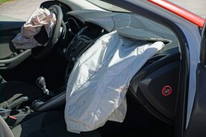 crashed car with airbags deployed