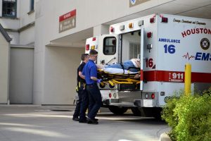 Medical staff removing a patient from an ambulance