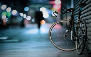 a bicycle parked on a sidewalk