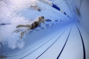 A man swimming in a pool