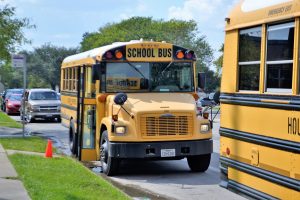 School buses picking children up